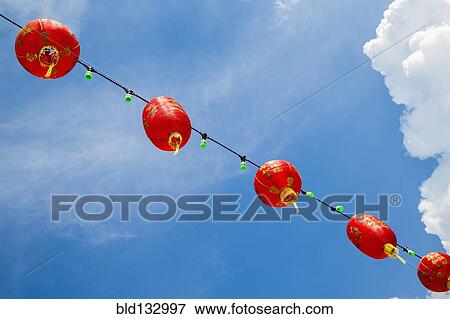 Stock Photo - Chinese New Year Lanterns against blue sky. Fotosearch
