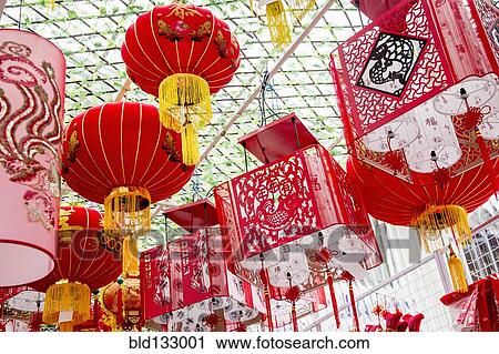 Stock Image - Chinese New Year lanterns hanging from ceiling. Fotosearch