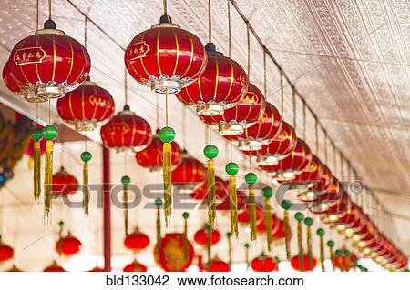 Stock Image - Chinese New Year lanterns hanging from ceiling, George Town, Penang, Malaysia. Fotosearch
