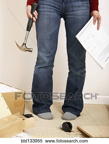 Chinese woman building shelves in home View Large Photo Image Stock Photography - Chinese woman building shelves in home. Fotosearch