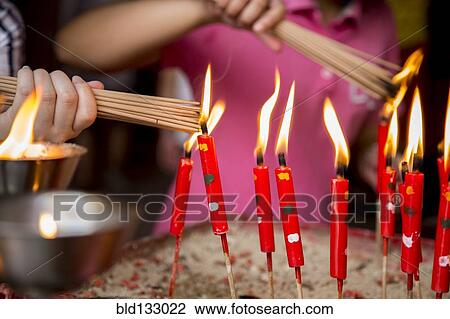 Close up of children lighting incense View Large Photo Image Stock Image - Close up of children lighting incense. Fotosearch