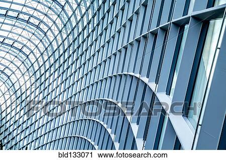 Close up of curved metal and glass building View Large Photo Image Stock Image - Close up of curved metal and glass building. Fotosearch