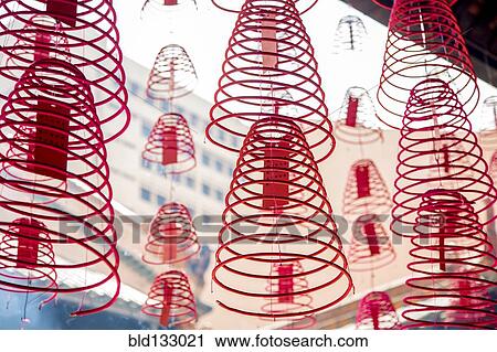 Stock Image - Close up of spiral incense with wishes. Fotosearch