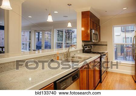 Stock Image - Countertops and sink in modern kitchen. Fotosearch