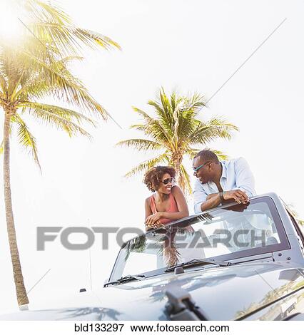 Couple relaxing together in car View Large Photo Image Stock Photo - Couple relaxing together in car. Fotosearch