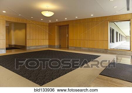 Empty lobby area in office building View Large Photo Image Stock Photograph - Empty lobby area in office building. Fotosearch