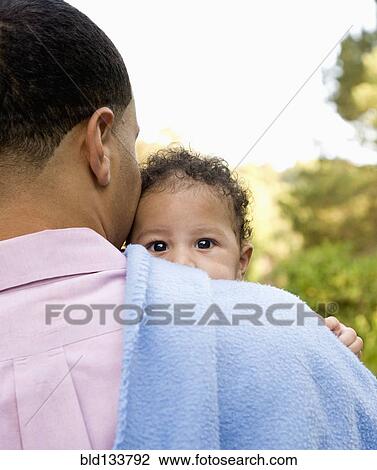 Father holding baby on shoulder View Large Photo Image Stock Image - Father holding baby on shoulder. Fotosearch