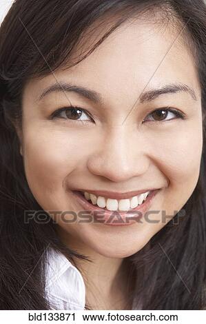 Stock Image - Filipino woman smiling. Fotosearch