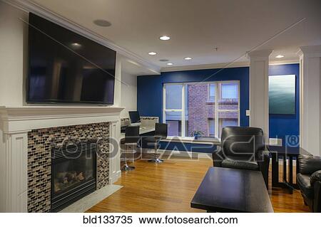 Stock Photography - Fireplace and television in common area. Fotosearch