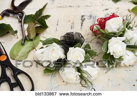 Stock Photo - Flower arrangements on work table in florist. Fotosearch