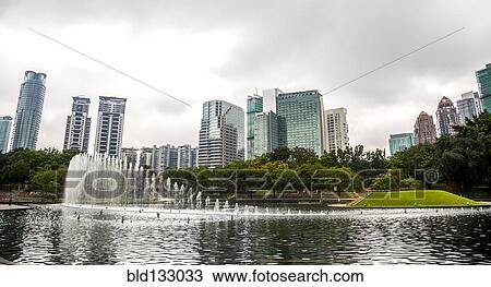 Stock Image - Fountain in lake in urban park, Kuala Lumpur, Federal Territory of Kuala Lumpur, Malaysia. Fotosearch