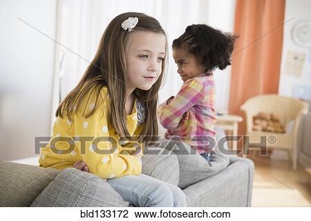 Girls fighting on sofa View Large Photo Image Stock Image - Girls fighting on sofa. Fotosearch
