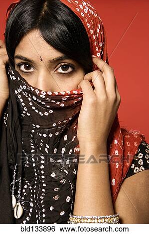 Stock Photograph - Indian woman wearing headscarf. Fotosearch
