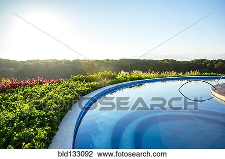 Infinity pool overlooking rural landscape View Large Photo Image Stock Image - Infinity pool overlooking rural landscape. Fotosearch