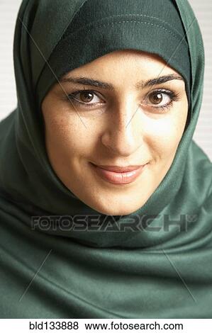 Middle Eastern woman wearing headscarf View Large Photo Image Stock Photo - Middle Eastern woman wearing headscarf. Fotosearch