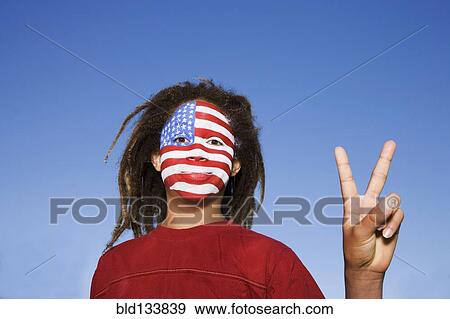 Stock Photo - Mixed race boy with American flag painted on face. Fotosearch