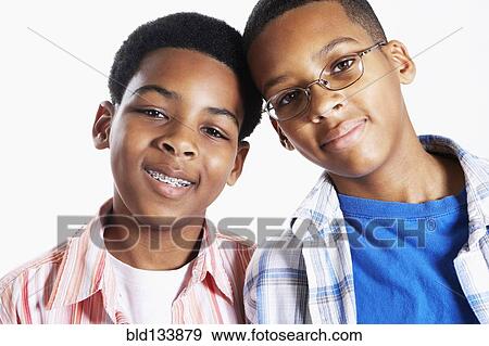 Mixed race boys smiling View Large Photo Image Stock Photo - Mixed race boys smiling. Fotosearch