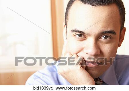 Stock Photography - Mixed race businessman smiling. Fotosearch