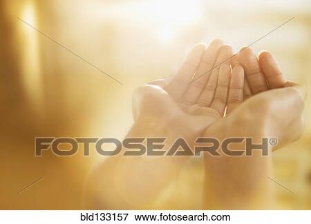 Mixed race woman holding out cupped hands View Large Photo Image Stock Photo - Mixed race woman holding out cupped hands. Fotosearch