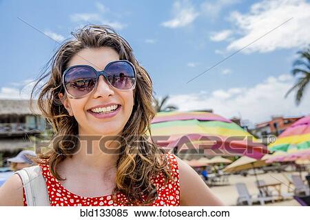 Mixed race woman smiling on tropical beach View Large Photo Image Stock Photography - Mixed race woman smiling on tropical beach. Fotosearch
