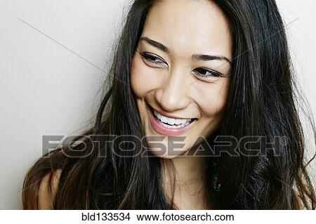 Picture - Mixed race woman smiling. Fotosearch