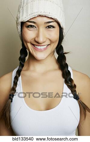 Stock Image - Mixed race woman smiling. Fotosearch