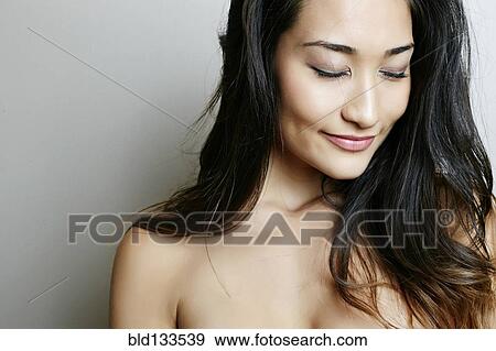 Mixed race woman with eyes closed View Large Photo Image Stock Photo - Mixed race woman with eyes closed. Fotosearch