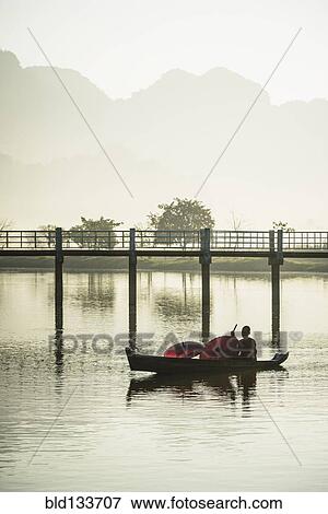 Mountains and bridge reflected in still lake, Hpa an, Kayin, Myanmar View Large Photo Image Stock Photo - Mountains and bridge reflected in still lake, Hpa an, Kayin, Myanmar. Fotosearch