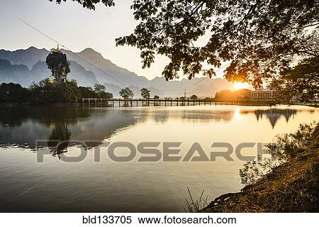 Mountains and bridge reflected in still lake, Hpa an, Kayin, Myanmar View Large Photo Image Stock Photography - Mountains and bridge reflected in still lake, Hpa an, Kayin, Myanmar. Fotosearch