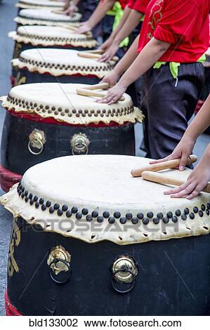 Musicians playing drums at Chinese New Year celebration View Large Photo Image Stock Image - Musicians playing drums at Chinese New Year celebration. Fotosearch