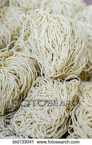 Stock Image - Noodles for sale in market. Fotosearch