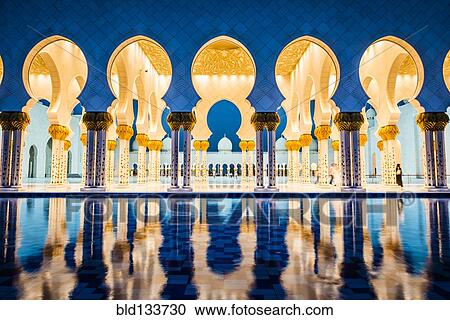 Stock Image - Ornate tiled arches of Grand Mosque, Abu Dhabi, United Arab Emirates. Fotosearch