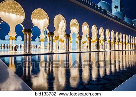 Stock Image - Ornate tiled arches of Grand Mosque, Abu Dhabi, United Arab Emirates. Fotosearch