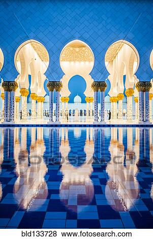 Stock Photo - Ornate tiled arches of Grand Mosque, Abu Dhabi, United Arab Emirates. Fotosearch