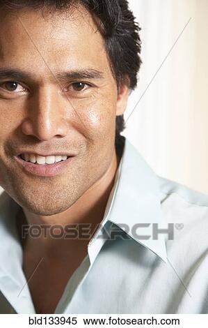 Stock Photography - Pacific Islander man smiling. Fotosearch