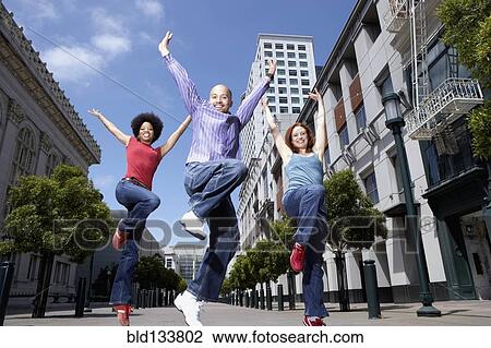Stock Image - People dancing on city street. Fotosearch