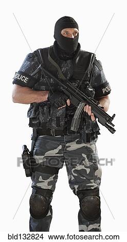 Police officer in gear holding assault rifle View Large Photo Image Picture - Police officer in gear holding assault rifle. Fotosearch