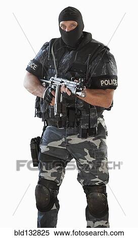 Stock Photography - Police officer in gear holding assault rifle. Fotosearch