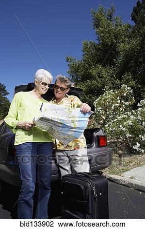 Senior Caucasian couple reading roadmap View Large Photo Image Stock Image - Senior Caucasian couple reading roadmap. Fotosearch