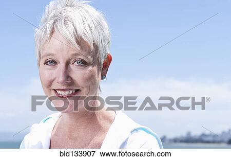 Stock Photo - Senior Caucasian woman smiling outdoors. Fotosearch