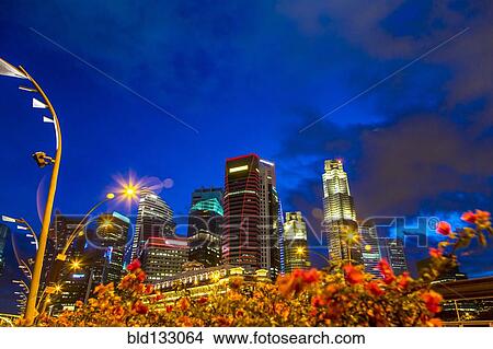 Singapore city skyline lit up at night, Singapore, Republic of Singapore View Large Photo Image Picture - Singapore city skyline lit up at night, Singapore, Republic of Singapore. Fotosearch