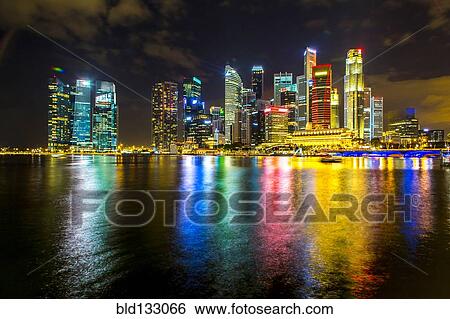 Stock Photograph - Singapore city skyline lit up at night, Singapore, Republic of Singapore. Fotosearch