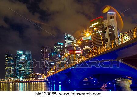 Stock Photography - Singapore city skyline lit up at night, Singapore, Republic of Singapore. Fotosearch