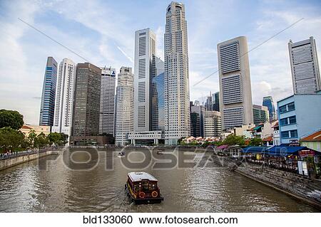 Stock Image - Singapore city skyline overlooking water, Singapore, Republic of Singapore. Fotosearch