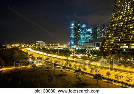 Stock Image - Singapore cityscape lit up at night, Singapore, Republic of Singapore. Fotosearch