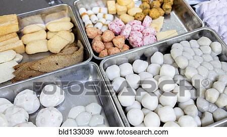 Soy cakes and fish for sale in market View Large Photo Image Stock Photo - Soy cakes and fish for sale in market. Fotosearch
