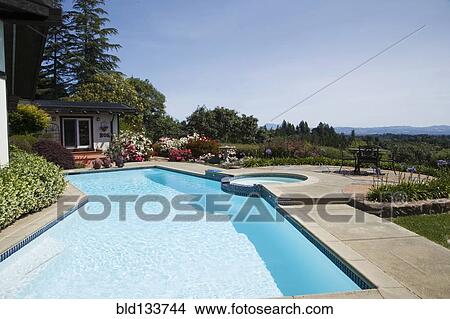 Picture - Swimming pool overlooking rural landscape. Fotosearch