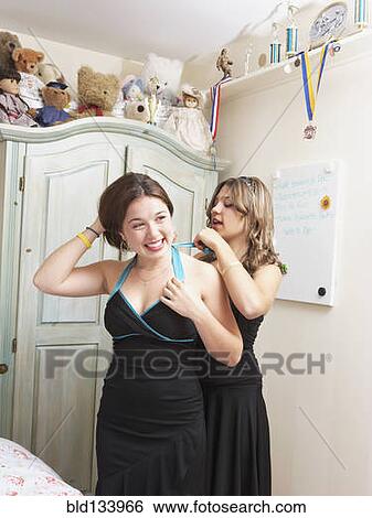 Teenage girls getting ready for dance together View Large Photo Image Stock Photograph - Teenage girls getting ready for dance together. Fotosearch
