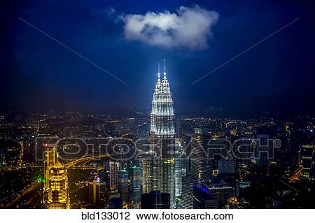 Stock Image - View of city skyline lit up at night, Kuala Lumpur, Malaysia. Fotosearch