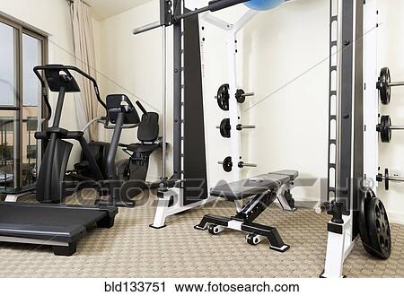 Weights and exercise machines in gym View Large Photo Image Stock Image - Weights and exercise machines in gym. Fotosearch